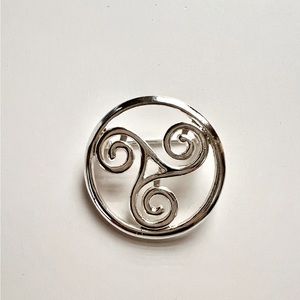 Vintage silver tone solder triskele brooch